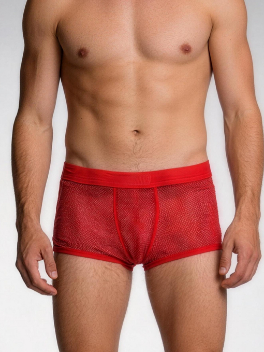 Red mesh underwear worn by a person on a plain background