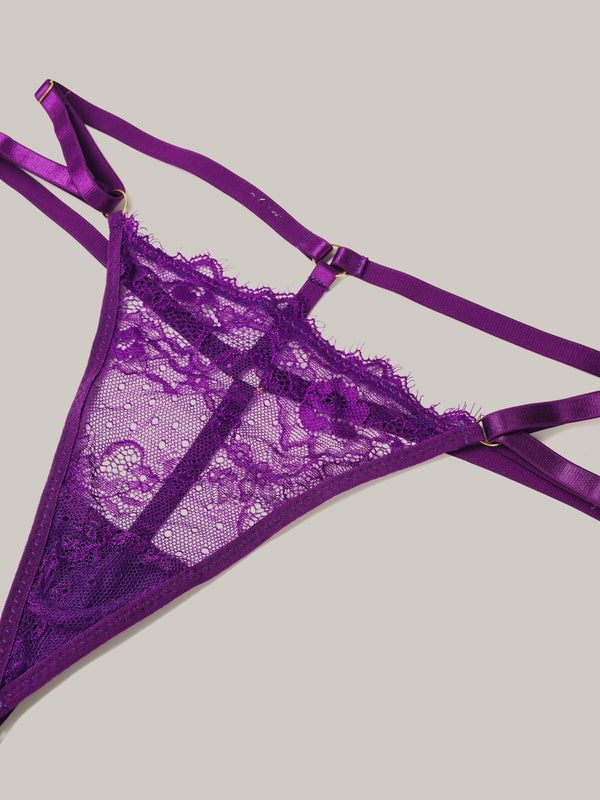 Purple lace lingerie set on a light gray background